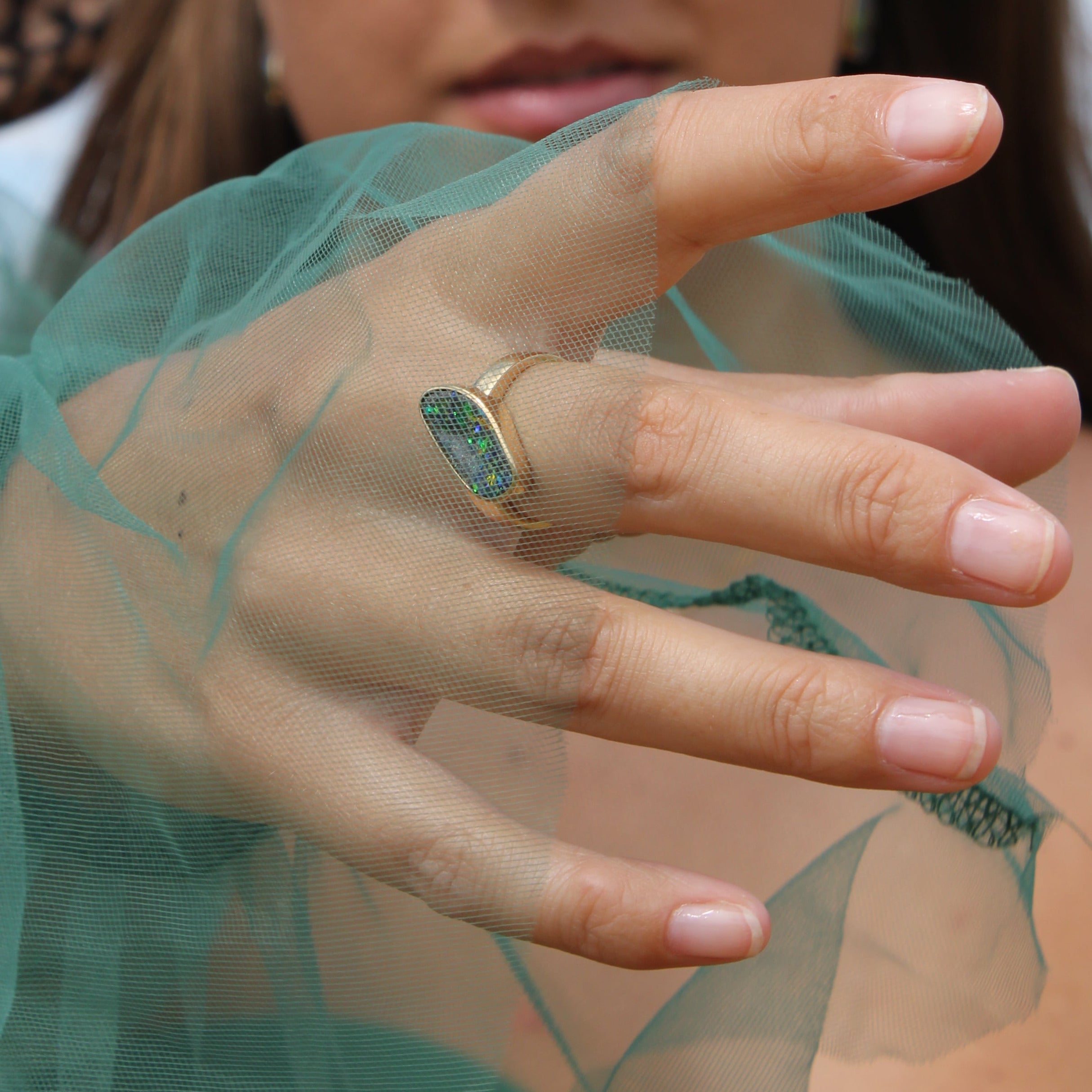 Who should not wear an opal ring?