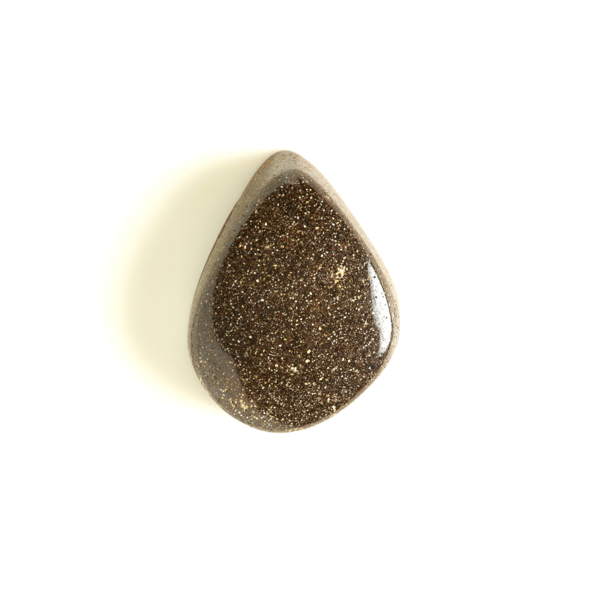 A polished teardrop-shaped brown ironstone polished back of opal gemstone, photographed on a clean white background.