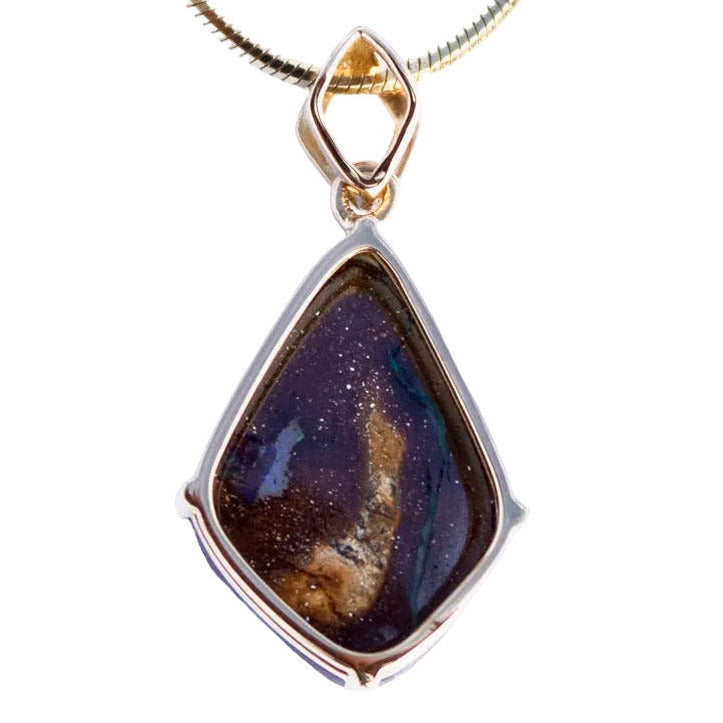 Necklace with a pendant featuring a natural stone design on a white background