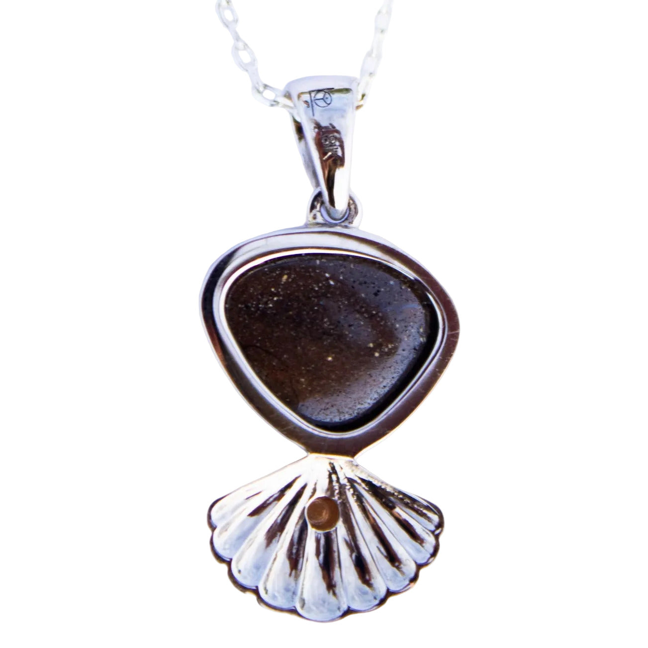 Necklace with a dark brown pendant and silver shell design on a white background