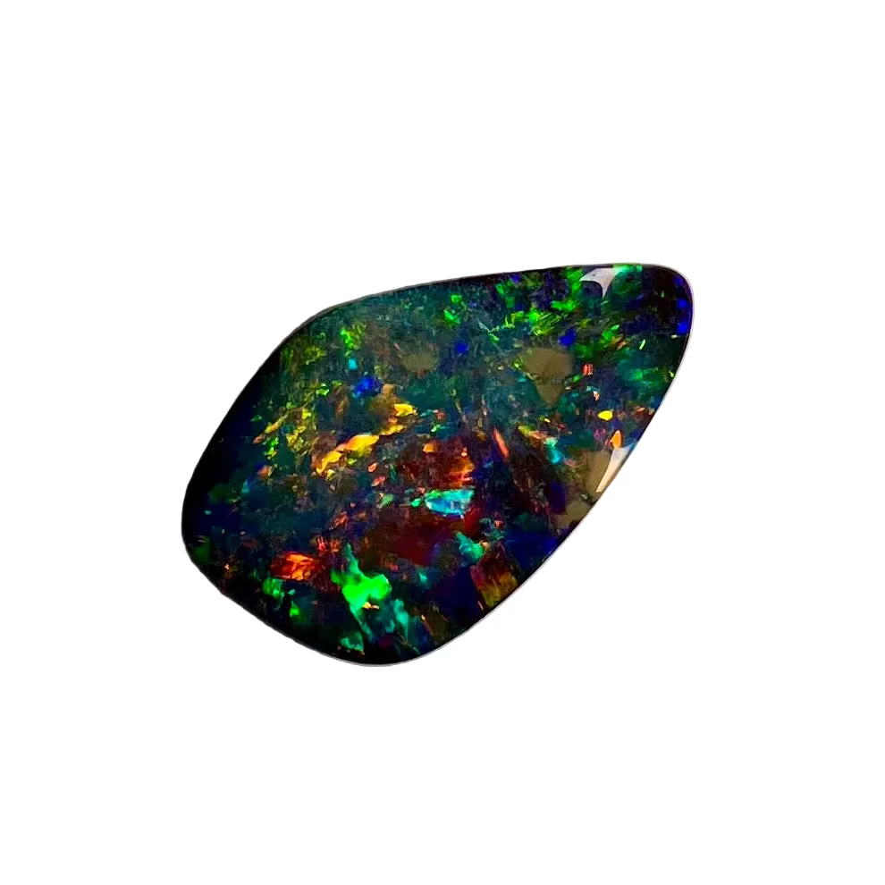 Multicolored opal stone on a beige background