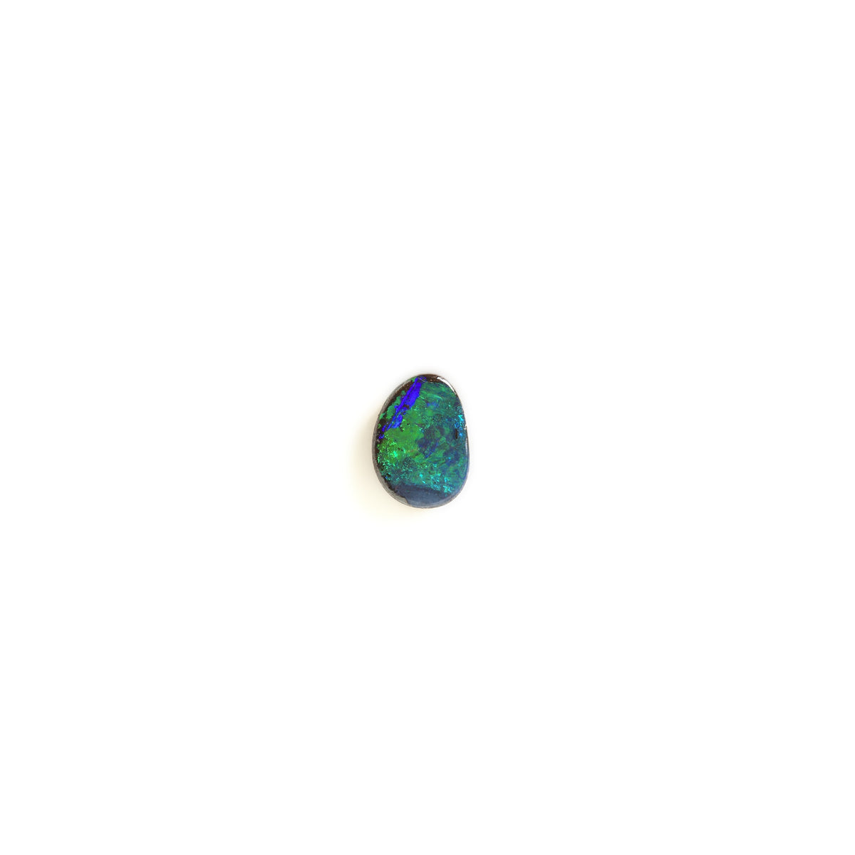 A small free form-shaped iridescent gemstone with vibrant blue and green flashes, centered on a plain white background.