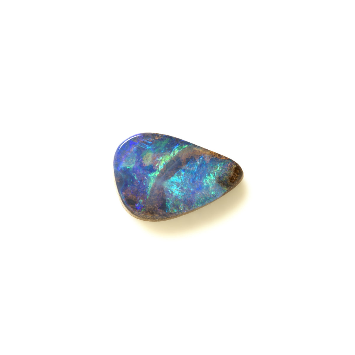 A small, irregularly shaped natural opal gemstone displaying vibrant blue, green, and purple iridescent colors with dark brown edges, set against a plain white background.