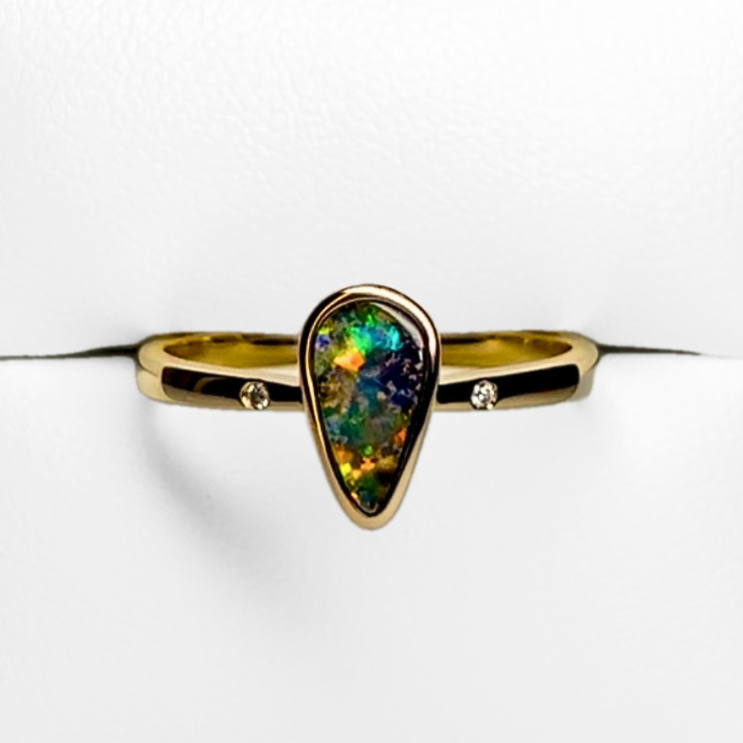 video of tear drop shaped boulder opal moving side to side showing off its mesmerising pattern and play of colour display. Watch as the stone moves the colours shift between yellows, reds, blues, aquas, greens and oranges. 